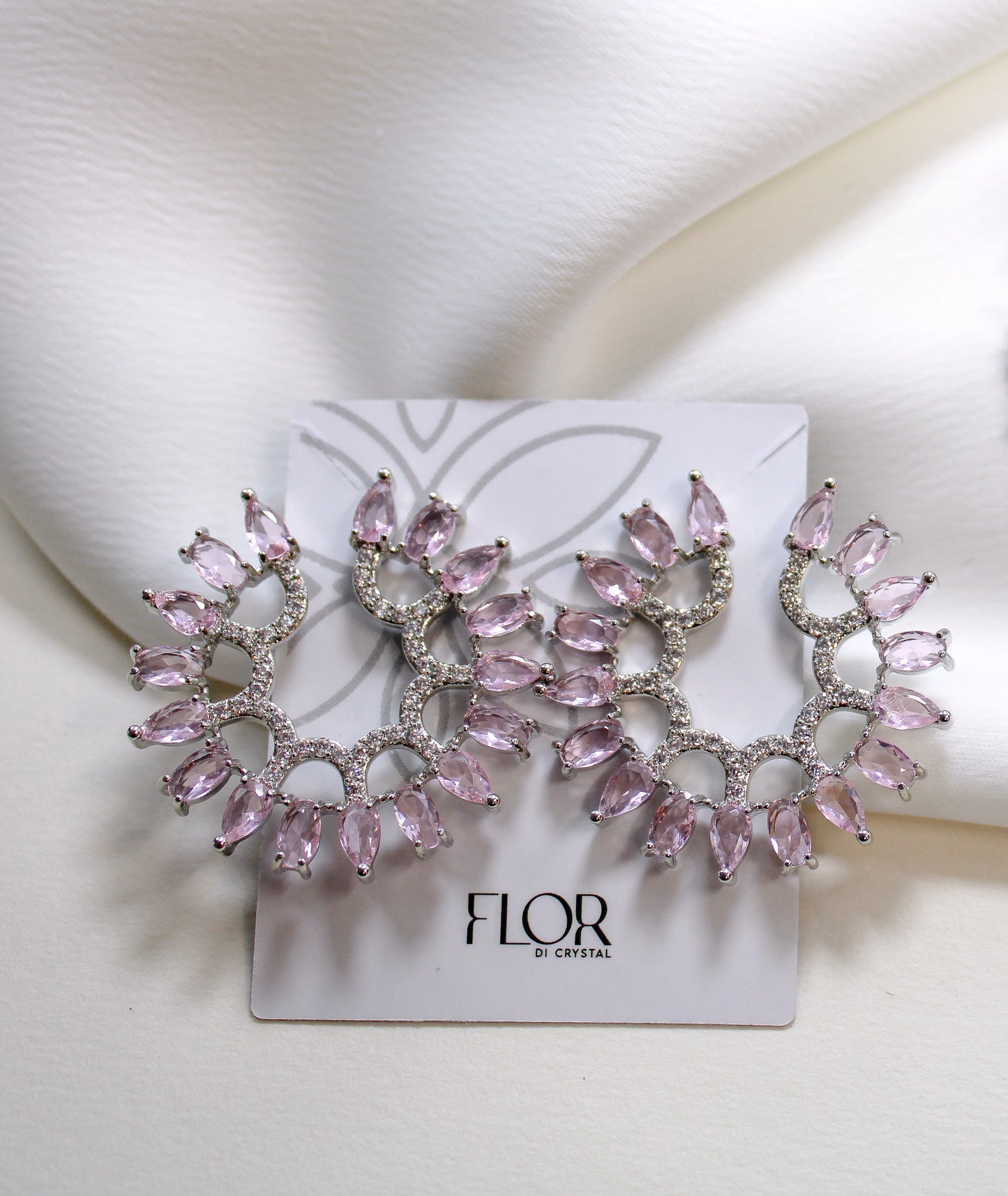 Circular earing in pink and clear zirc.