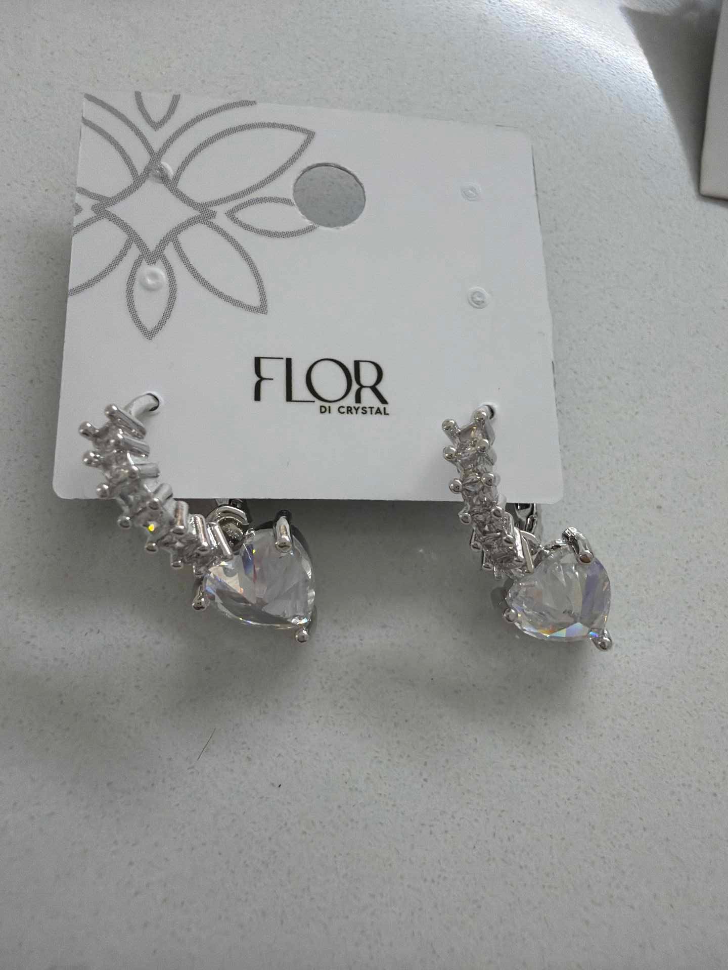 Paved hoop earings with clear heart pendant 