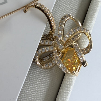 Conjunto colar e brinco laço com pedra amarelo