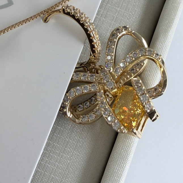 Conjunto colar e brinco laço com pedra amarelo